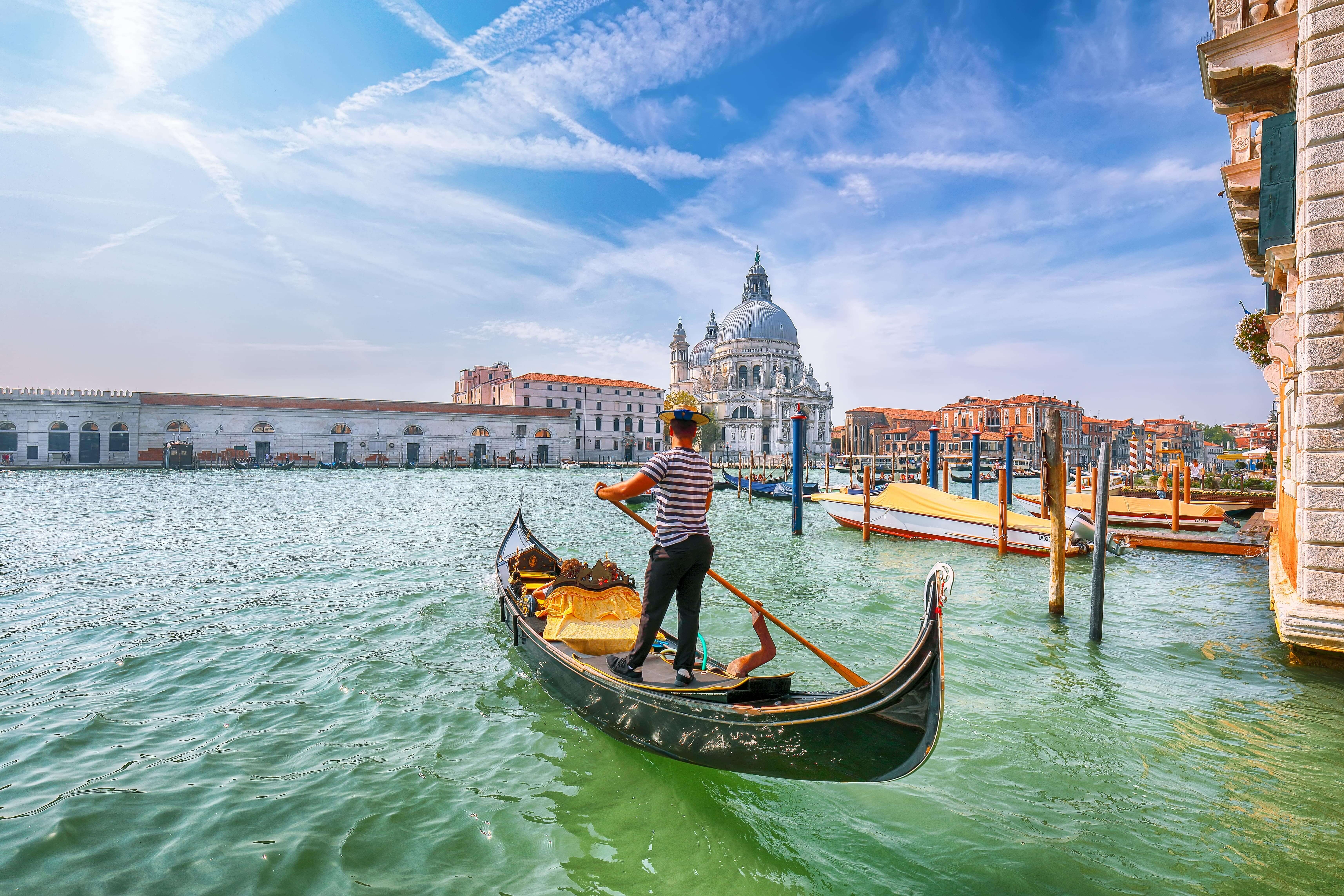 Breathtaking morning cityscape of Venice with famous Canal Grande and Basilica di Santa Maria della Salute church. Venice, Italy.